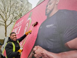 Anthony Joshua spotted putting up a billboard of his own face to market his new sports drink