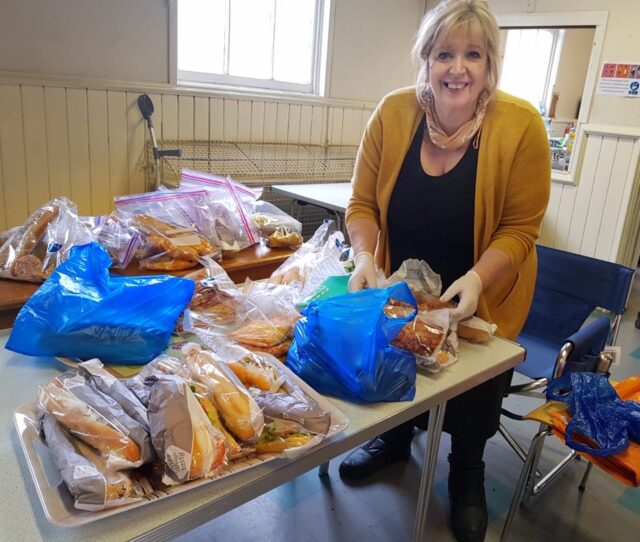 Volunteer Martha preparing takeaway food at BDCA's foodbank on Wednesday 18 March
