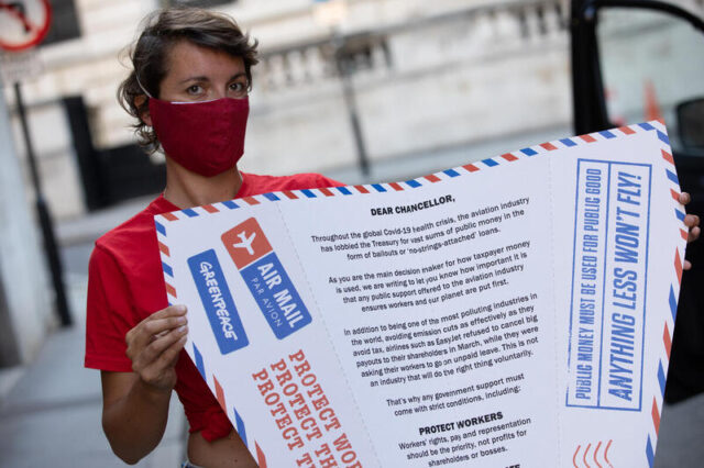 Greenpeace Activists Deliver Giant Paper Plane Aviation Bailout Letter in London