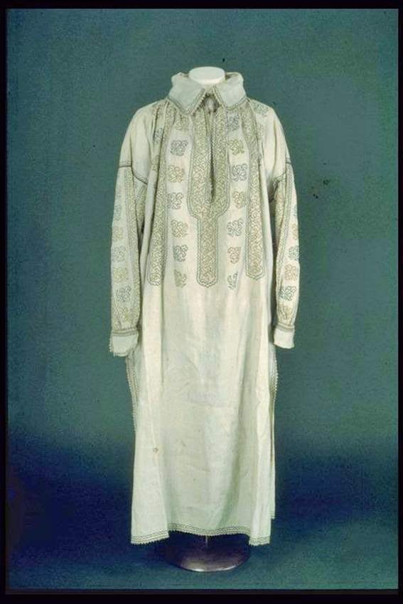 White linen man's shirt with attached collar.