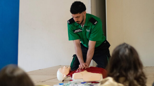 St John volunteer demonstrating how to save a life