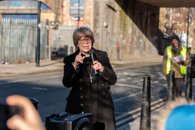 Bishop Sarah speaks to those attending Public Event by Cable Street Site