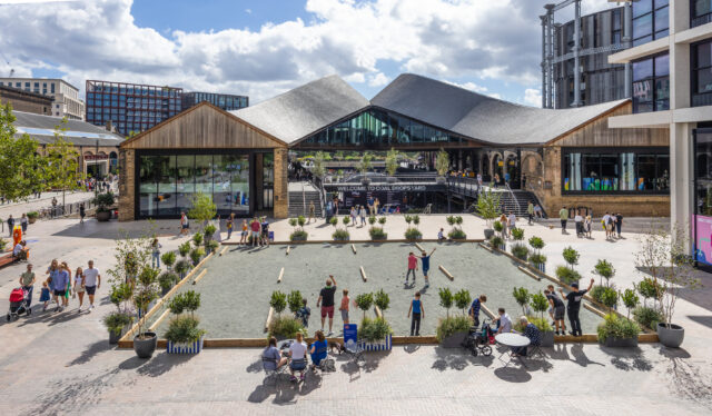 People playing Petanque (Boules) on the pitch in Cubitt Square, King's Cross