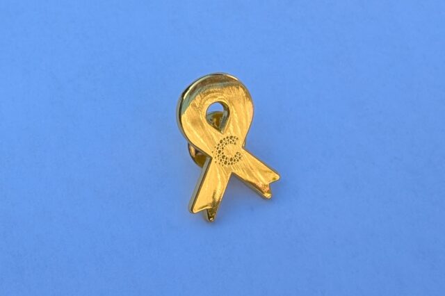 Cancer Research UK gold ribbon badge 2