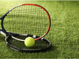 How AI Is Starting to Influence Professional Sports Two tennis rackets and a yellow ball resting on grass, illustrating Wimbledon’s grass-court tradition